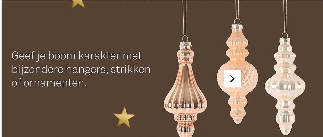 Geef je boom karakter met bijzondere hangers, strikken of ornamenten.