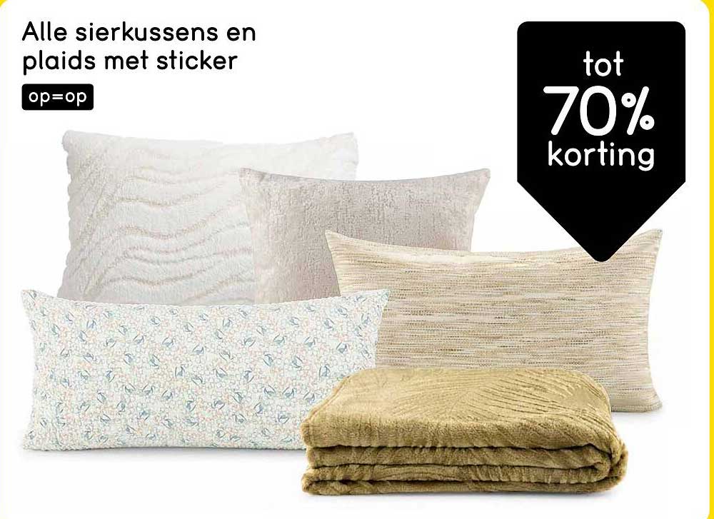 Alle sierkussens en plaids met sticker op=op
