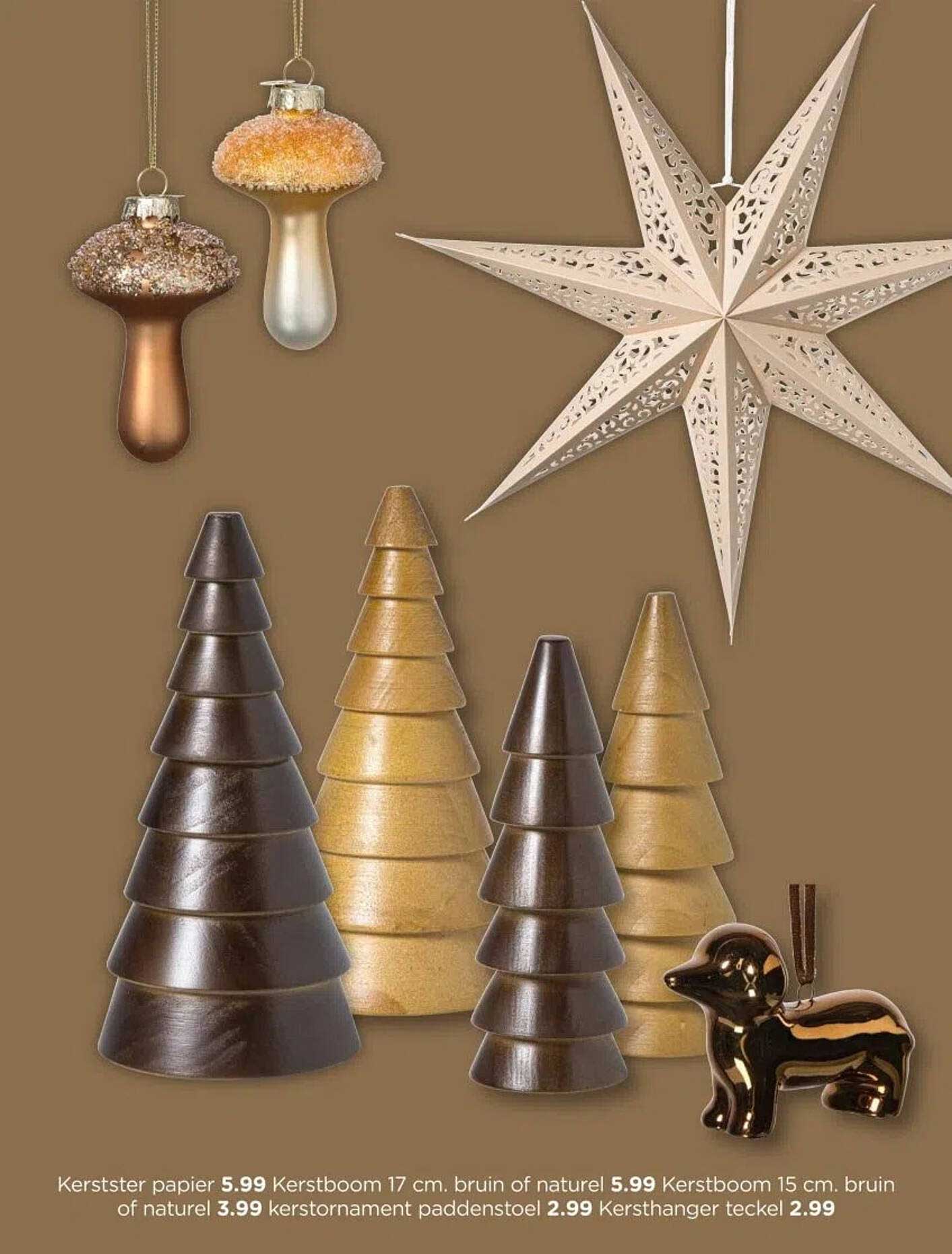 Kerstster papier 5.99, Kerstboom 17 cm. bruin of natuur 5.99, Kerstboom 15 cm. bruin of natuur 3.99, Kerstornament paddenstoel 2.99, Kersthanger teckel 2.99